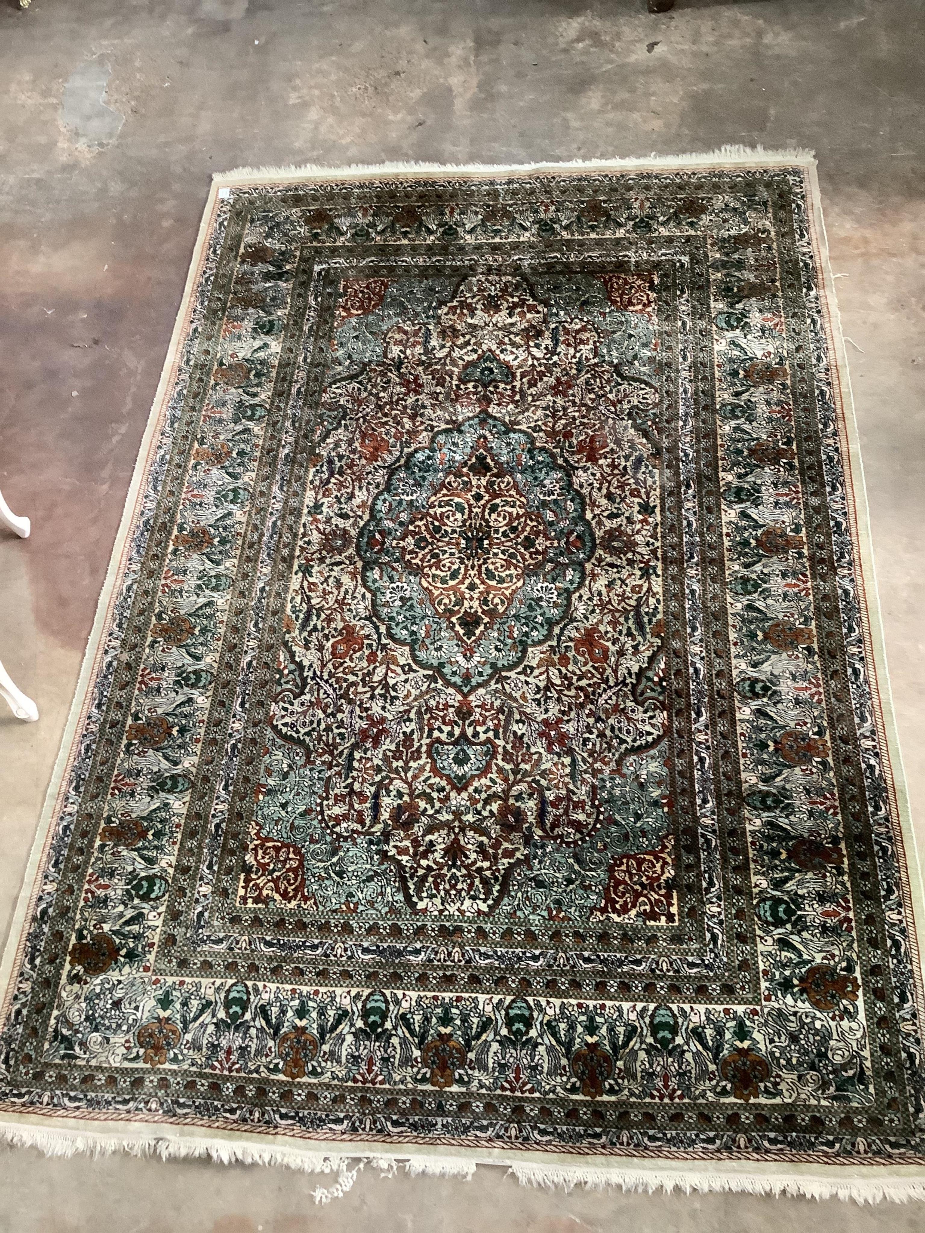 A Persian design ivory ground rug, 272 x 182cm. Condition - fair